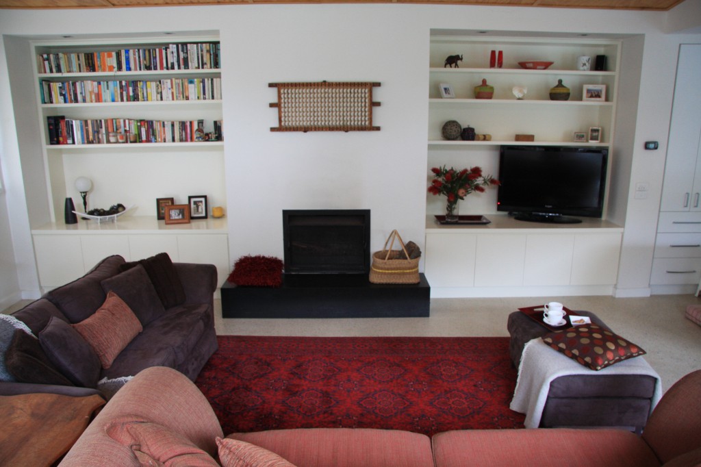 Twin built-in entertainment units set into alcoves